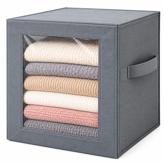 Grey fabric storage box with a transparent front window and side handle, filled with folded knitwear
