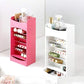 Pink and white tall cosmetic racks with slanted shelves holding lipsticks and perfume bottles